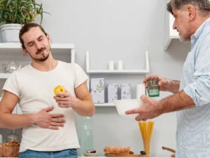Man with stomach pain and apple
