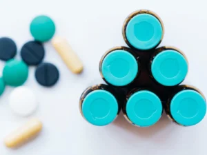 Medical vials and scattered pills