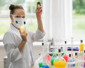 Scientist holding test tubes in a lab